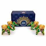 Green and gold elephant-shaped tealight candle holders with intricate patterns in personalized diwali gifts hamper set