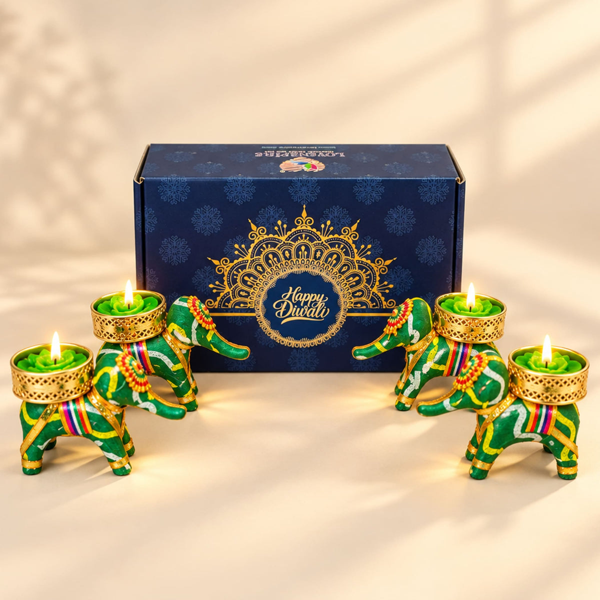Green and gold elephant-shaped tealight candle holders with intricate patterns for personalized diwali gift hamper set