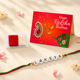 Personalized white bead designer rakhi with gold lettering laksya and red green braided cord for brother and bhabhi