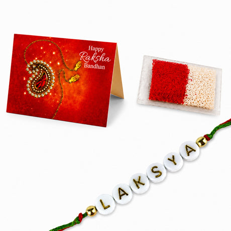 Designer custom named rakhi with white circular beads and gold lettering laksya on a green and red cord for protection