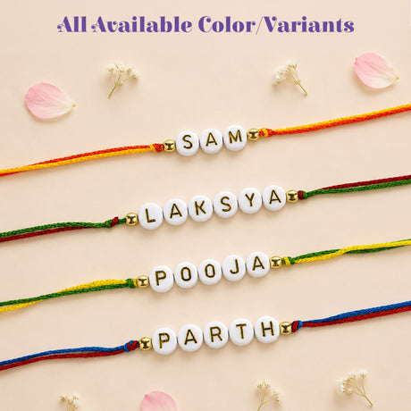Personalized designer custom named rakhi featuring white letter beads with gold foil on colorful braided cords for protection