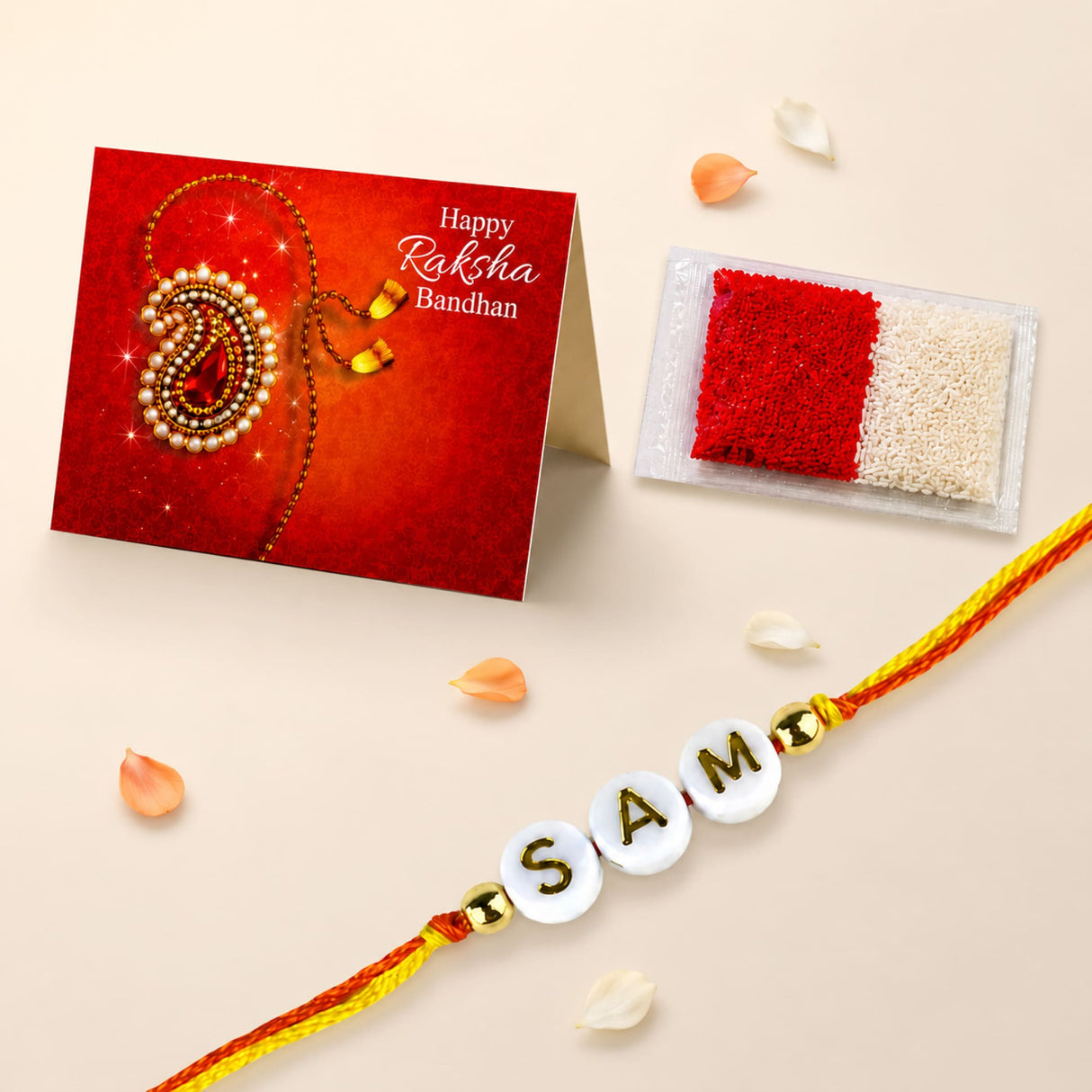A personalized white bead rakhi with gold lettering sam and golden beads on red and yellow thread for raksha bandhan