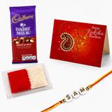 A vibrant red and gold handmade rakhi bracelet with white beads engraved with the name samt for raksha bandhan gift