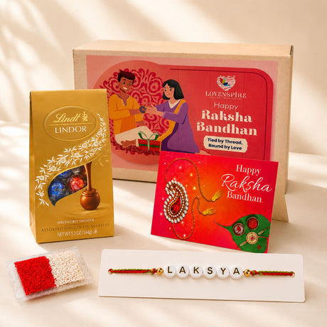 Red and gold paisley-themed personalized name bead rakhi with pearl embellishments for raksha bandhan gift set