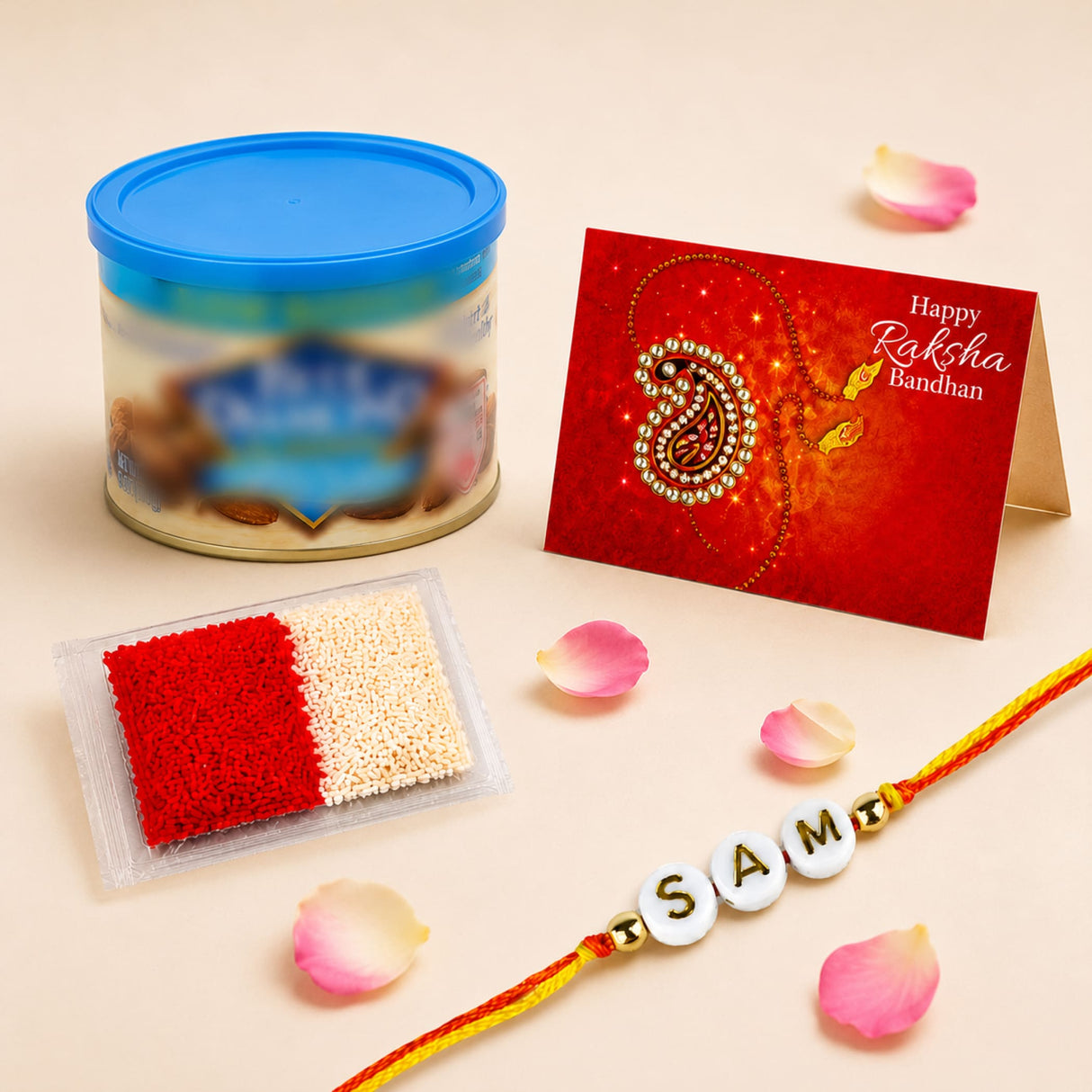 Personalized name rakhi for brother and bhabhi featuring a red and gold design with white beads spelling samt on yellow string