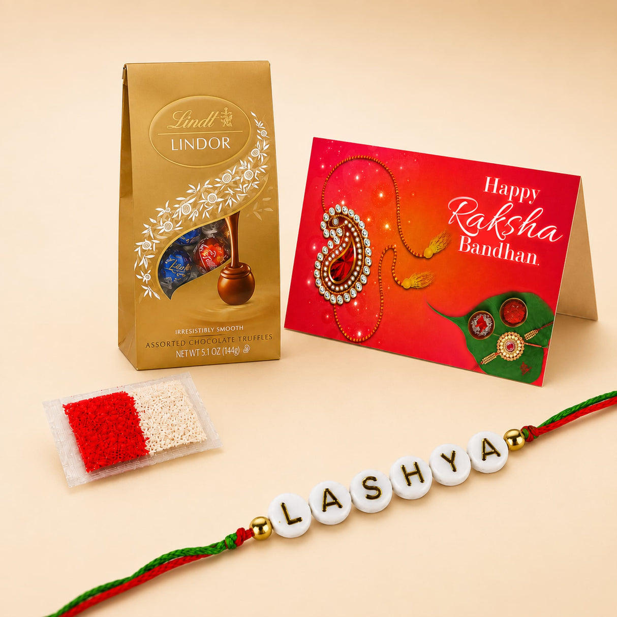 Personalized name bead rakhi for brother with white beads red and green thread and gold-colored beads spelling lashya