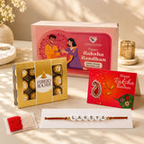 Gold-wrapped ferrero rocher chocolates in a golden box with white label included in personalized name bead rakhi gift set for brother