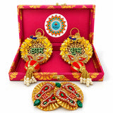 Golden personalized diwali gift hamper with intricate paisley designs red fabric green stones and white pearls for festive gifting