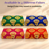 Personalized diwali gifts hamper featuring four ornate green blue pink and red fabric boxes with gold brocade design and clasp
