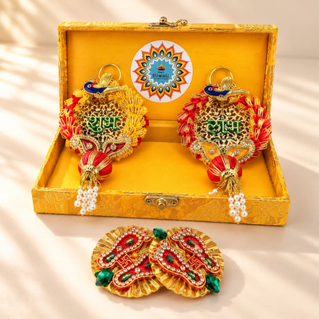 Personalized diwali gifts hamper with golden ornamental peacock designs red green embellishments and pearl tassels