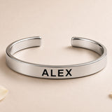 Personalized stainless steel rakhi cuff bracelet in silver with bold black engraved name alex for brother protection gift