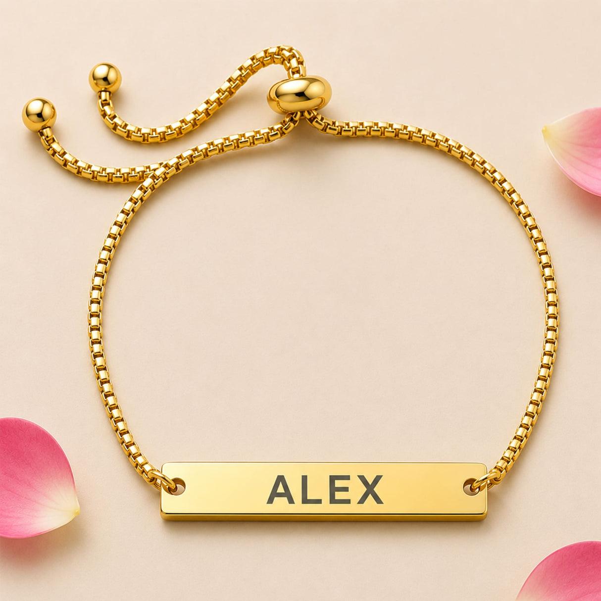 Gold-colored personalized stainless steel name rakhi with adjustable chain and rectangular nameplate engraved alex
