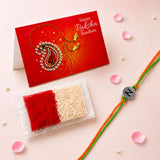 A vibrant orange and green braided designer custom single letter rakhi with a silver circular bead engraved with n
