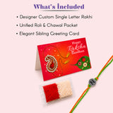 Designer custom single letter rakhi with orange and green braided threads and a silver n bead for raksha bandhan gift