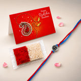 A red and blue braided rakhi with a silver n letter charm for brother and bhabhi protection and good luck gift