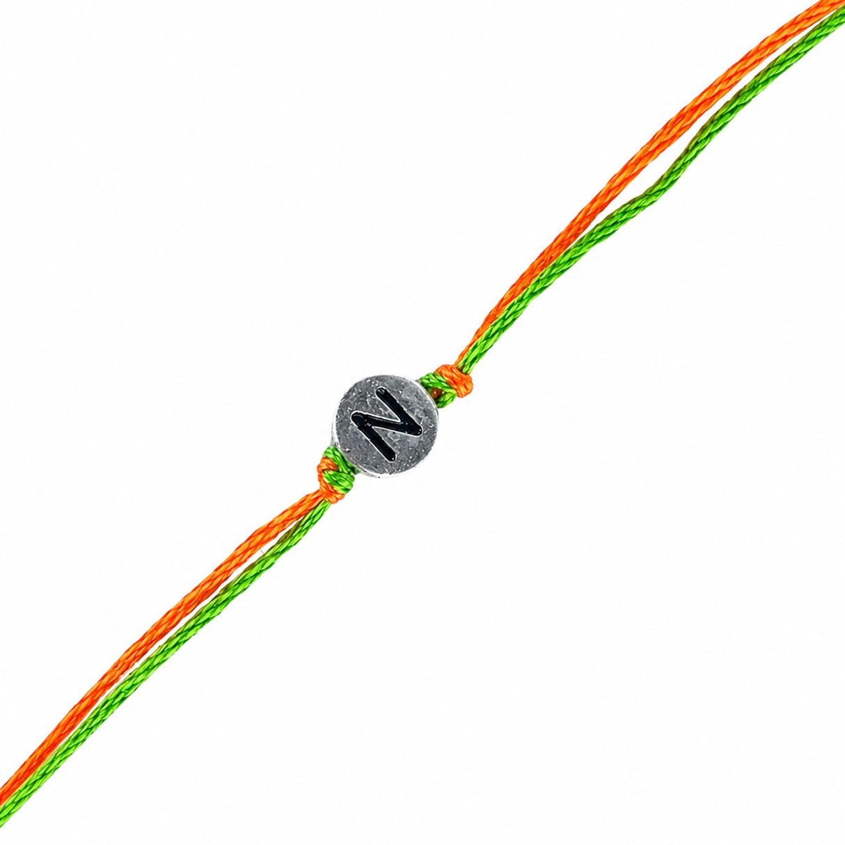 Designer custom single letter rakhi with silver-toned charm engraved with black n on braided orange and green cord