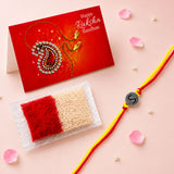 Designer custom single letter rakhi with red and yellow thread and silver toned circular s charm for protection and luck