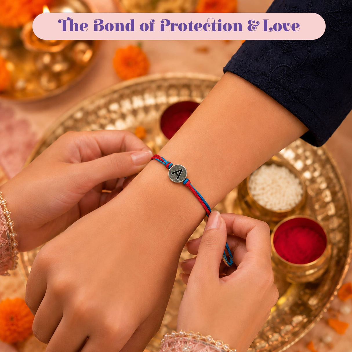 Designer custom single letter rakhi for brother and bhabhi with red and blue braided thread and silver engraved charm