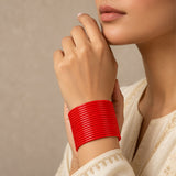 Vibrant red ribbed plain glass bangle bracelet worn on wrist, ideal for women and girls wedding jewelry