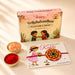 A colorful circular plantable seed rakhi bracelet with yellow and red mandala design on wooden base for brother and bhabhi