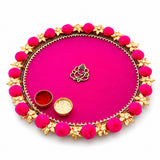 Steel pompom ganesha decorated pooja thali vibrant pink with golden border floral motifs and central gold ganesha charm