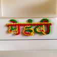 Mehendi decoration banner with colorful pom for groom