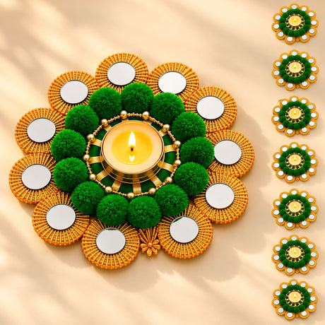 Golden and green decorative diya holder with mirrored petals and pom-poms featuring a central lit candle for Diwali pooja