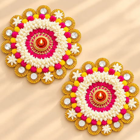 Rangoli mat tealight candle holder featuring vibrant pink white and yellow floral diya decorations with gold accents