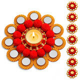 Red and gold rangoli mat tealight candle holder with mirrored petals and fluffy pom-poms for festive home decor