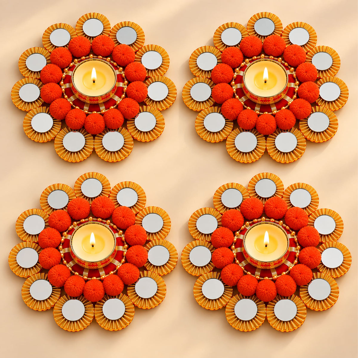 Orange pom-pom rangoli mat tealight candle holder with gold-rimmed mirror diya stand for festive home decor