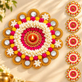 Rangoli mat tealight candle holder with vibrant rangoli design, jasmine flowers, pom-poms, gold accents, and central oil lamp