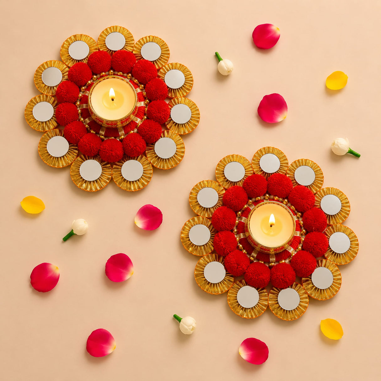 Red and gold decorative tea light candle holder rangoli mats with mirrored accents and lit candles for festive home decor