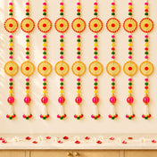 Vibrant handcrafted 2 strings wall backdrop hanging with woven red and gold pompom wheels beads and pink tassels for Diwali decor