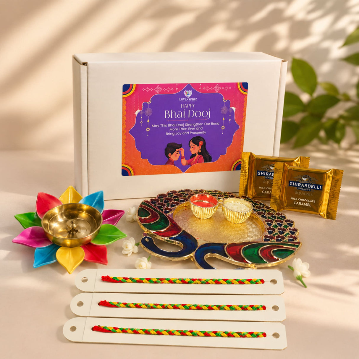 Colorful multi-petaled lotus brass diya with a golden bowl in bhai dooj gift hamper for brother premium gift box