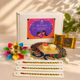 Colorful multi-petaled lotus brass diya with a golden bowl in bhai dooj gift hamper for brother premium gift box
