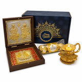 Golden lotus-shaped brass diya with a lit candle inside from a premium diwali gift hamper for festivals and corporate gifting
