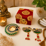 A vibrant red and gold ornate diwali gift hamper box with intricate paisley patterns and candle holder for festive gifting