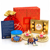 Diwali gift hamper featuring a red and gold patterned box with a golden drawstring potli bag for festive gifting
