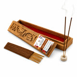 Premium saffron sandalwood scented incense sticks in carved wooden box with red interior and ceramic holder for pooja use