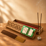 Premium scented heavenly rain incense sticks in a carved wooden box with red interior and two burning sticks on marble holder