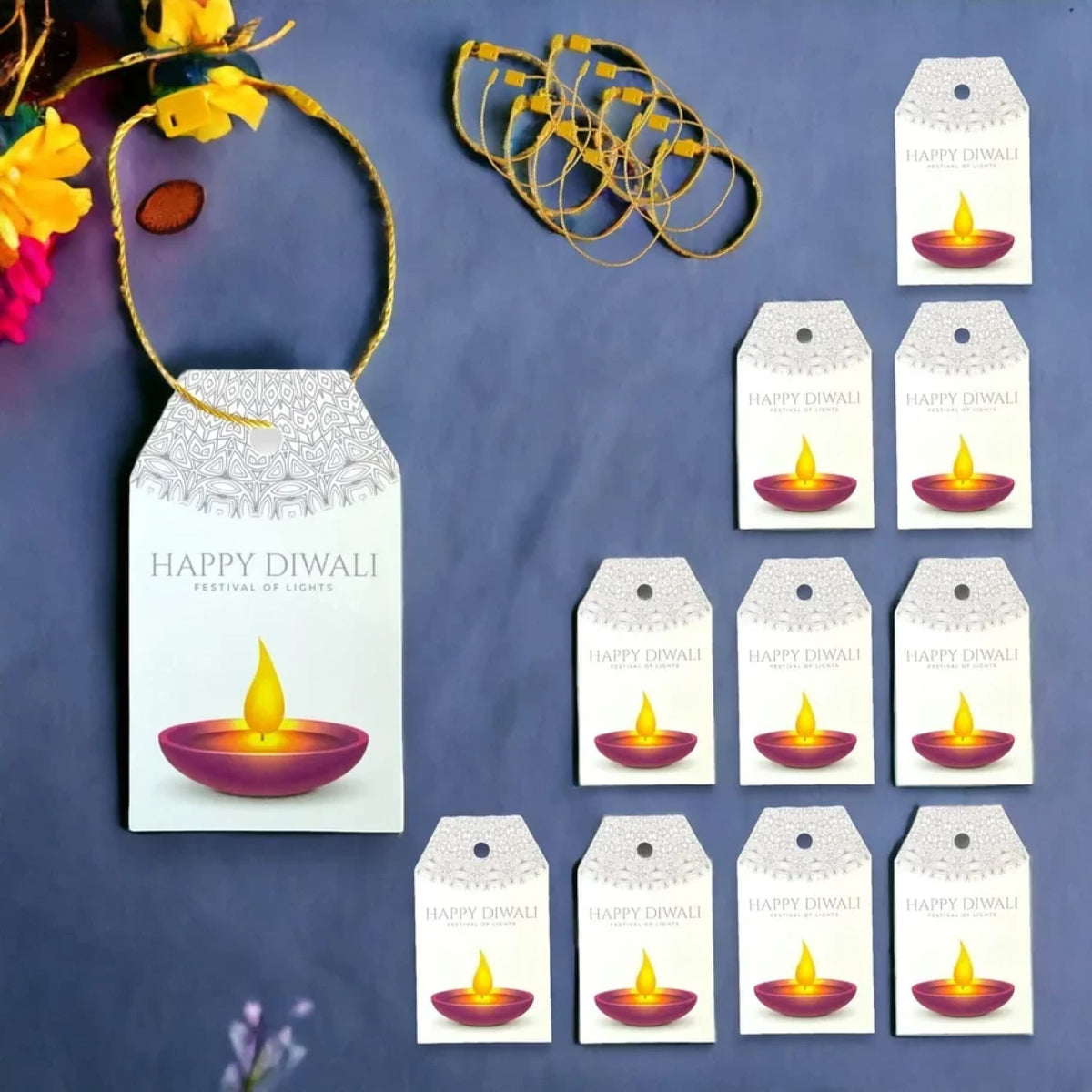 White paper happy diwali gift tag with silver lace border and purple diya illustration for hanging gift bags