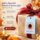 Light blue rectangular paper gift tag with gold embossed diwali lantern and happy diwali text attached to wrapped gift