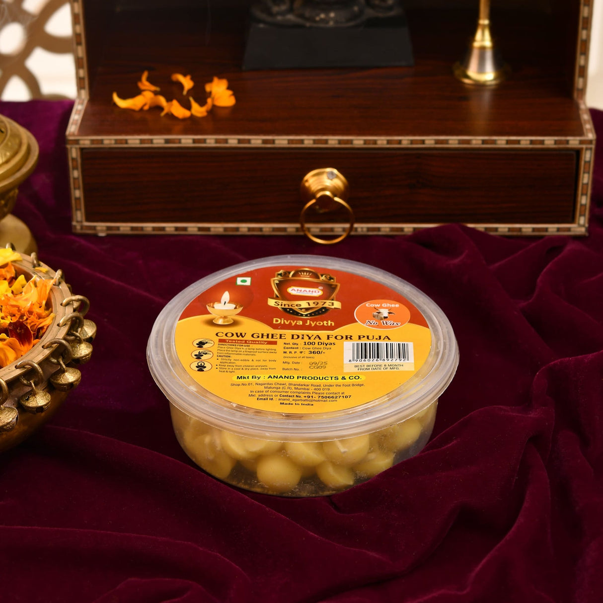 Clear plastic container with 100 golden-yellow pure cow ghee diyas by anand products for puja and pooja use