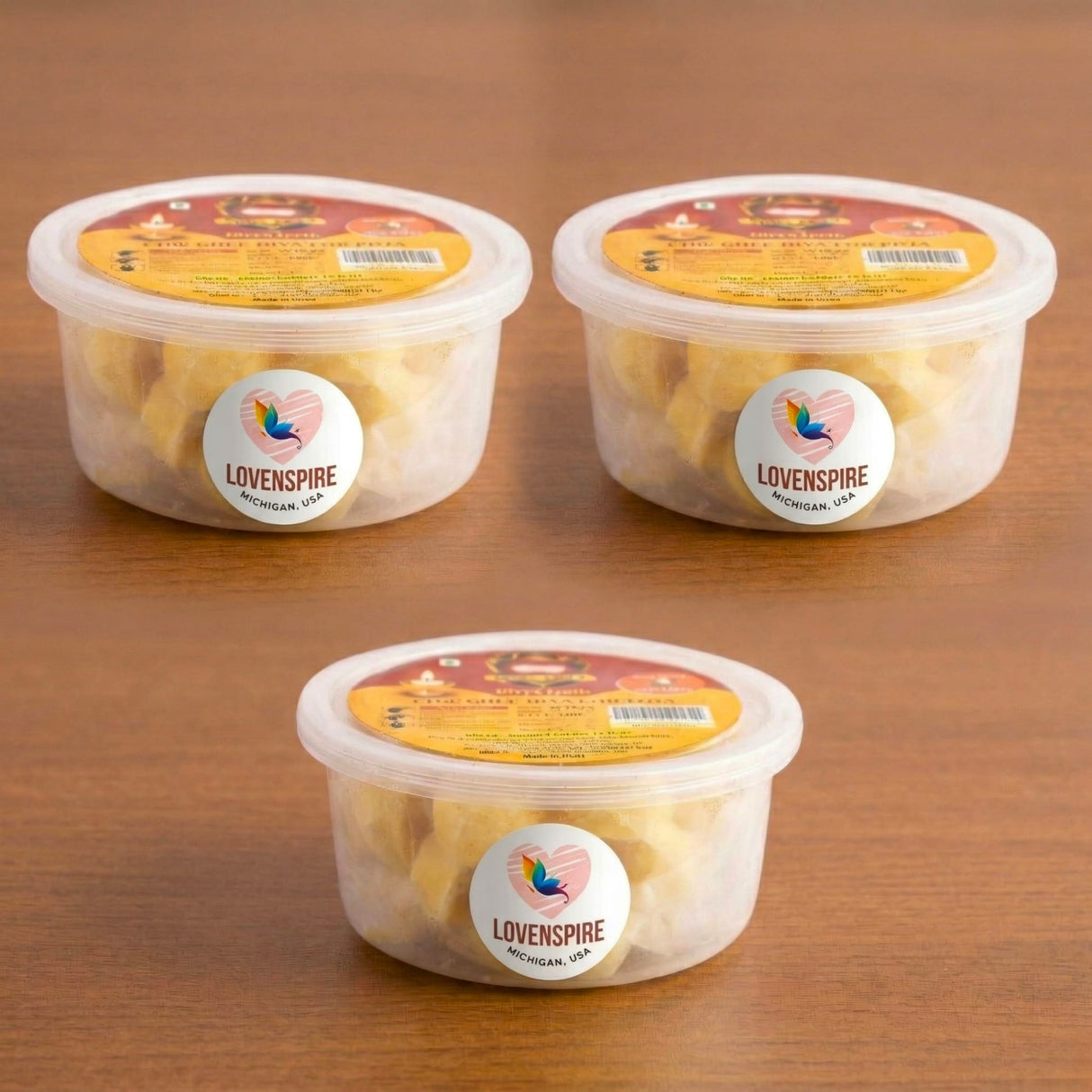 Three clear containers with yellow lids holding pale yellow pure ghee wicks for pooja diya jyot use