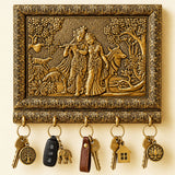Golden ornate hand crafted radha krishna key holder with pastoral relief and floral scrollwork for home entryway organization
