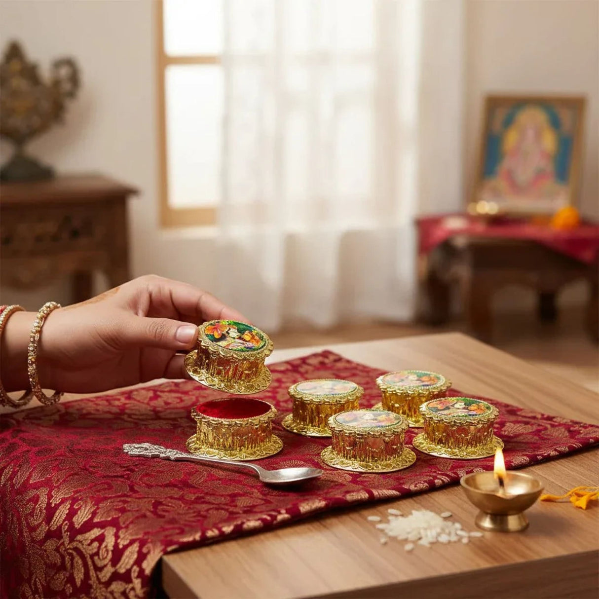 Golden ornate Radha Krishna haldi kumkum holder with floral lamps