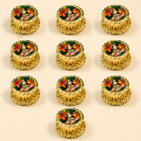 Golden ornate haldi kumkum holder boxes with intricate heart embossing and colorful Radha Krishna deity images