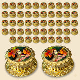 Golden ornamental oil lamps with intricate embossed designs and colorful deity images for pooja and hindu wedding gifts