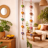 Colorful rajasthani heart-shaped door hanging wind chimes with gold detailing and small bells for home decor