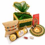 Green and gold ornate ganesha raksha bandhan gift hamper box with sheer green organza lining for brother and bhabhi